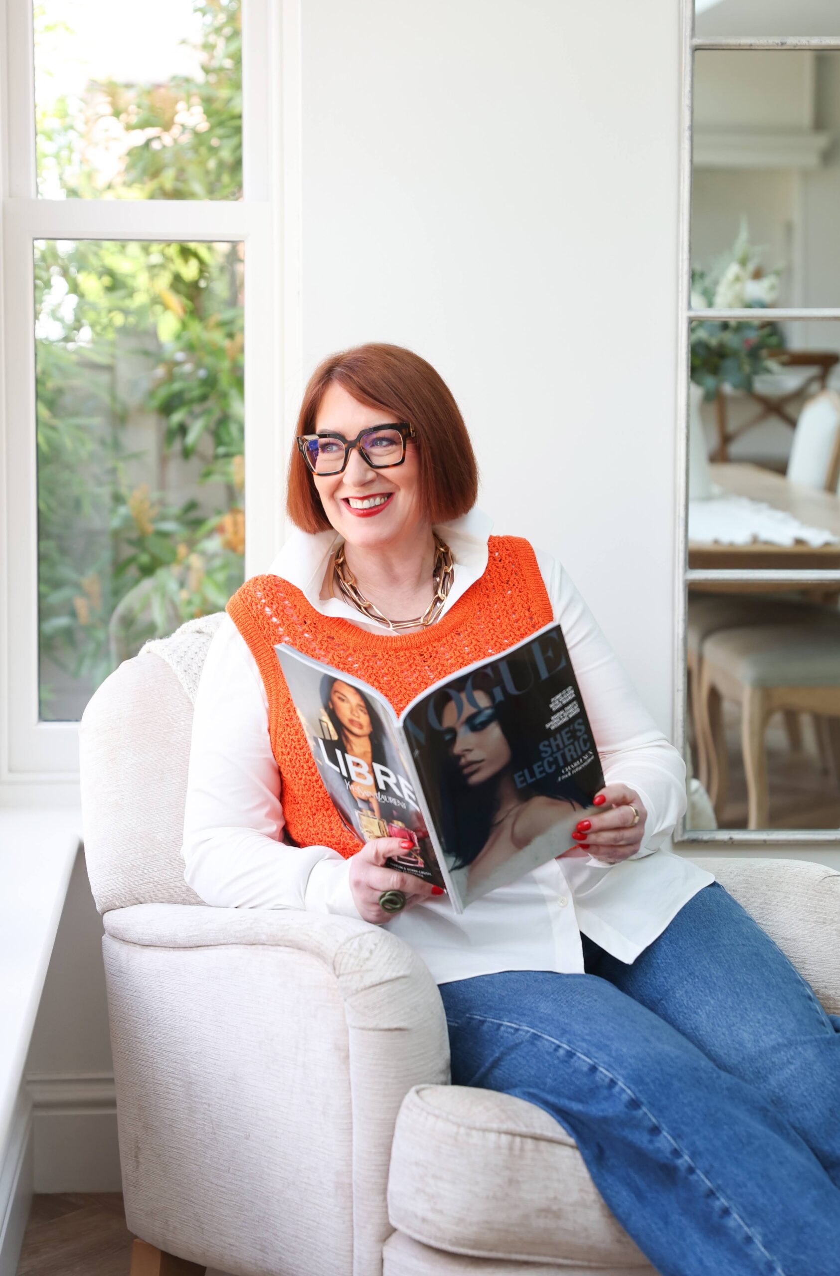 This image is on Jane sat down reading a magazine.